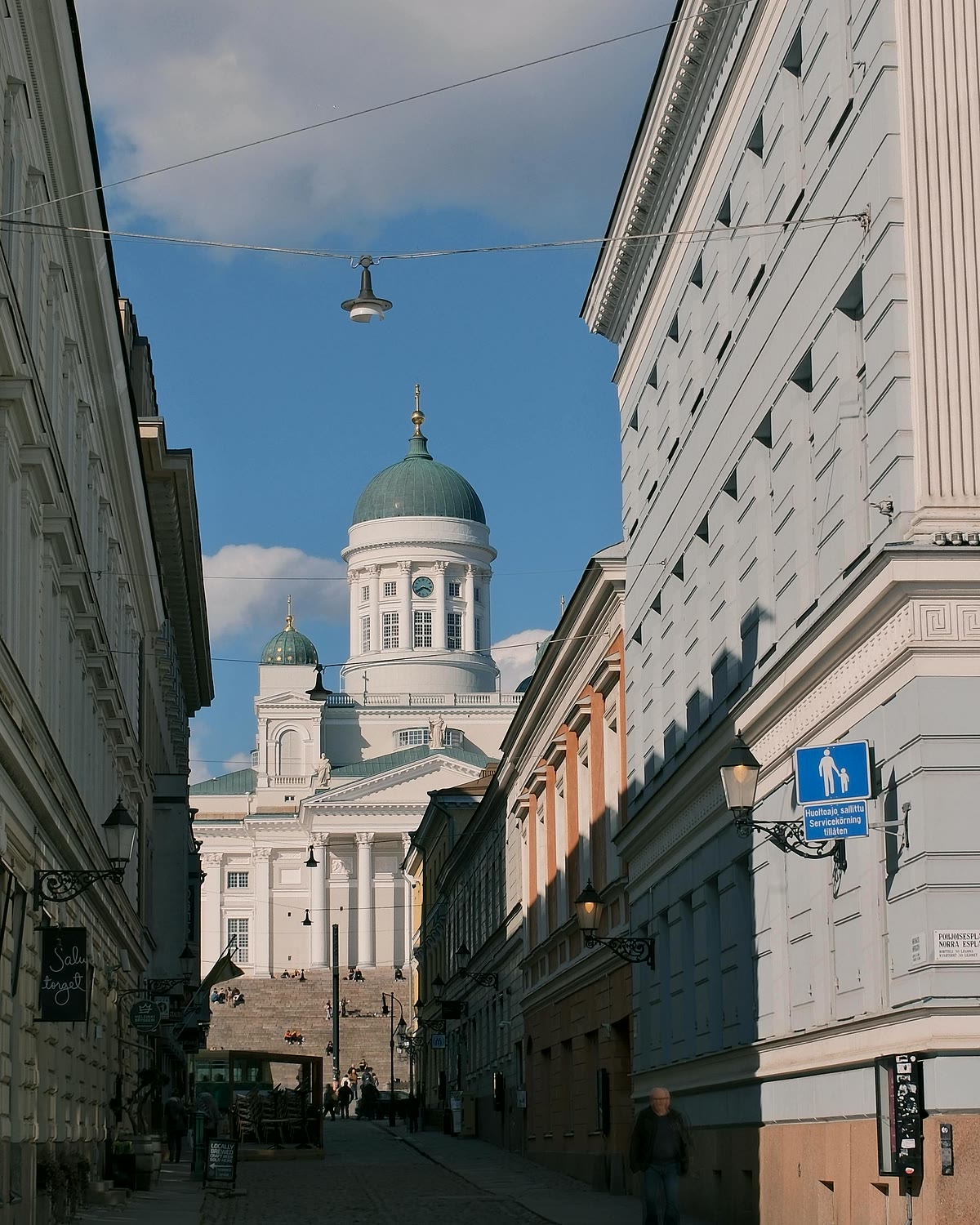 Helsinki Cathedral seen from a street of pale stone buildings