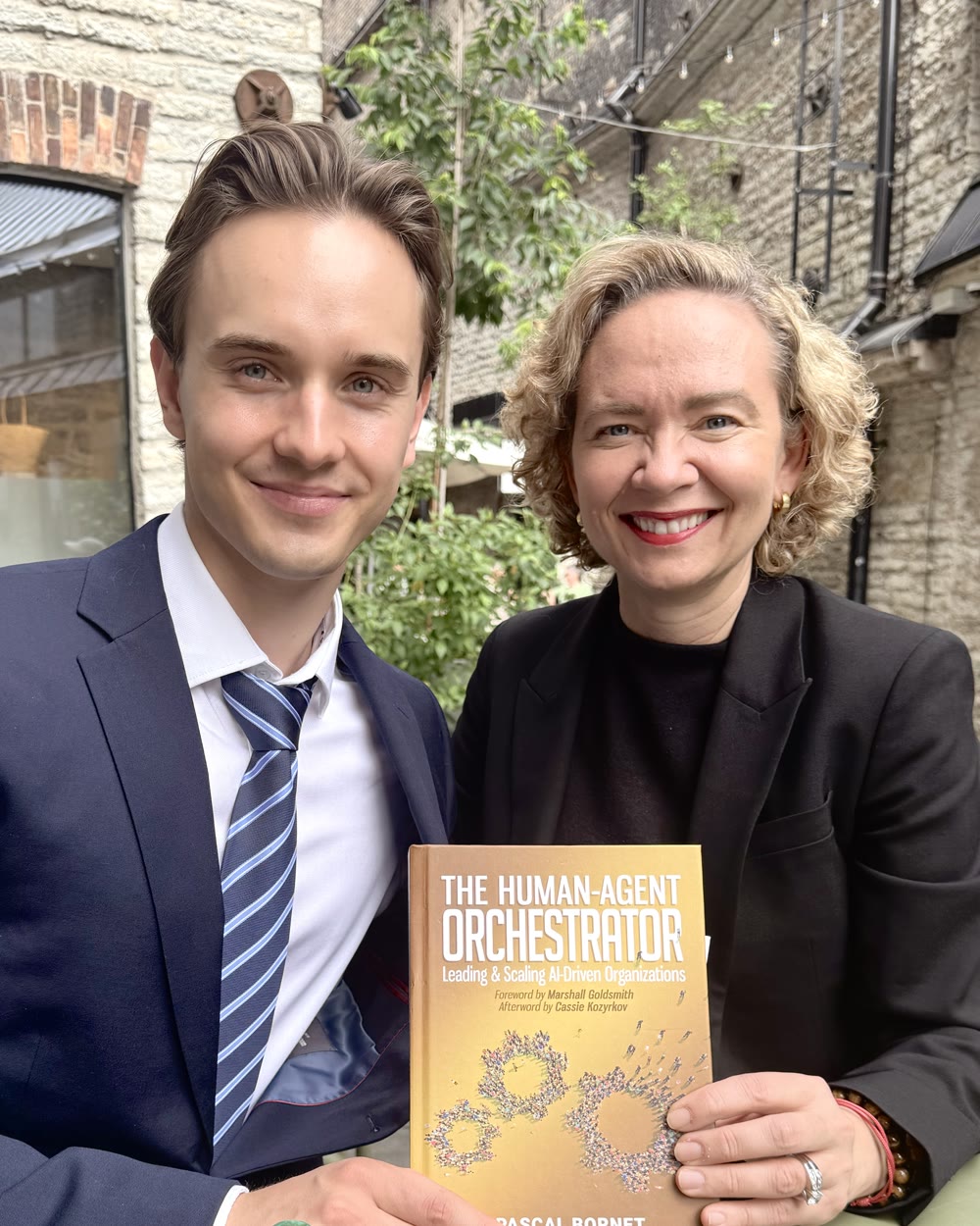 Tarja Stephens and a young reader holding the book.