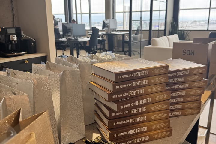 Copies of the book with gift bags at an event.